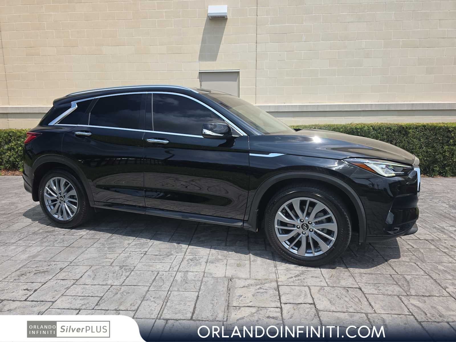 2024 INFINITI QX50 LUXE in Black Obsidian — front three-quarter view