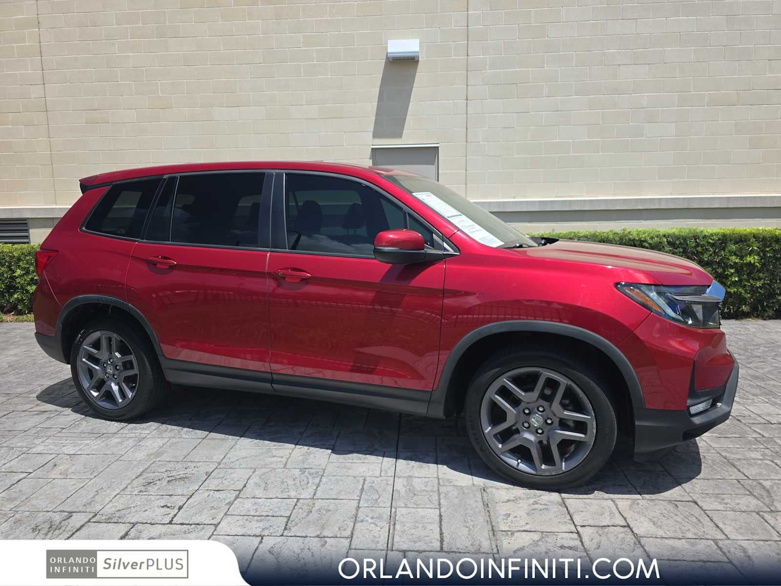2022 Honda Passport EX-L in Radiant Red Metallic II — front three-quarter view