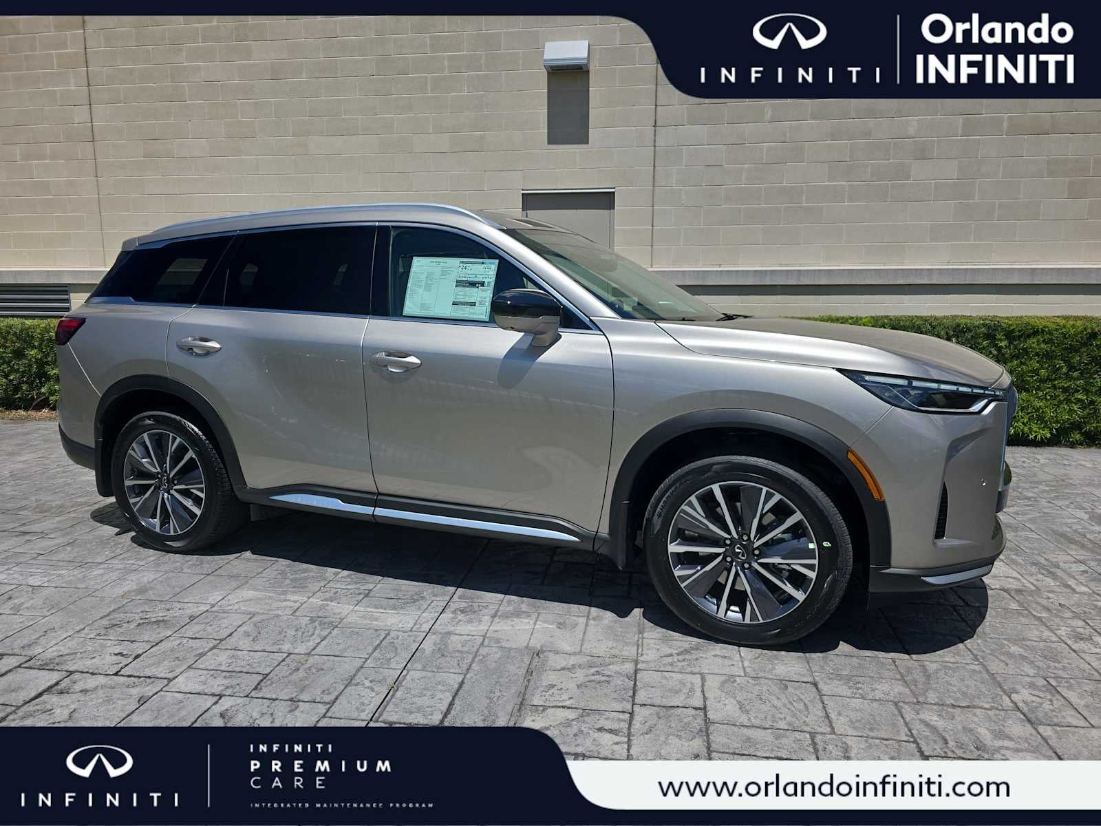 2026 INFINITI QX60 LUXE in Warm Titanium — front three-quarter view