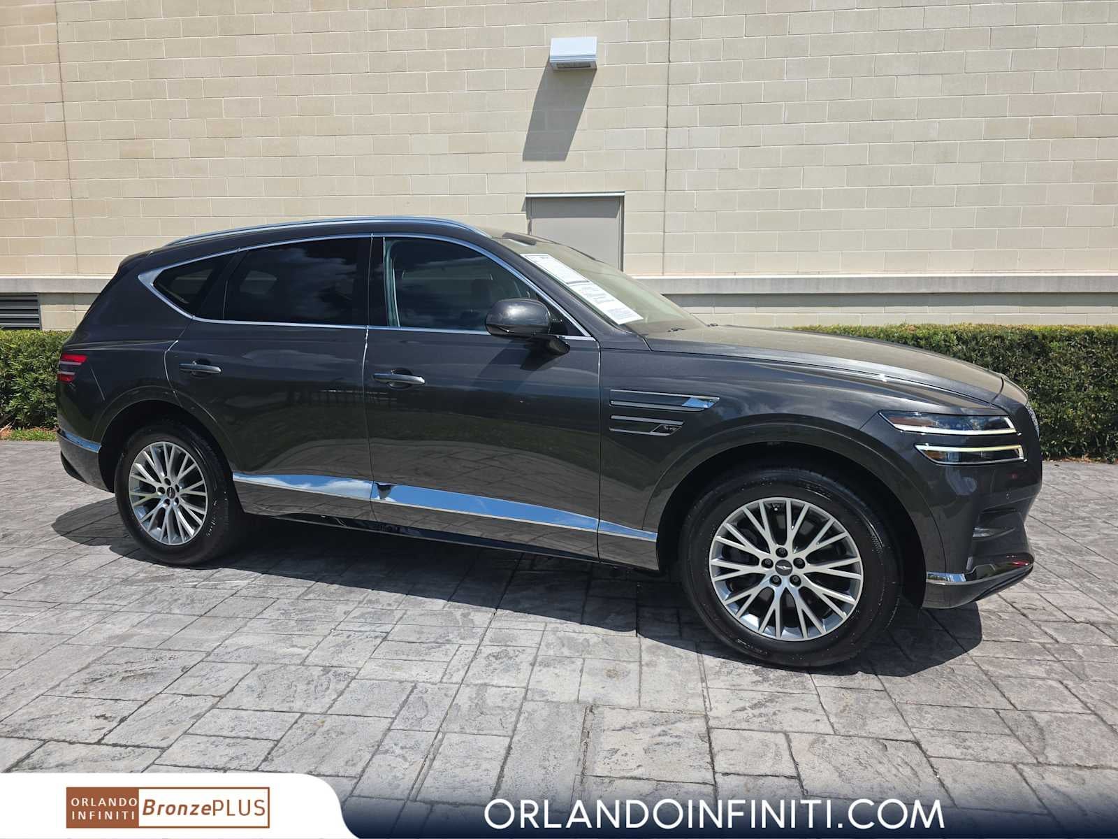 2024 Genesis GV80 2.5T AWD in Makalu Gray — front three-quarter view