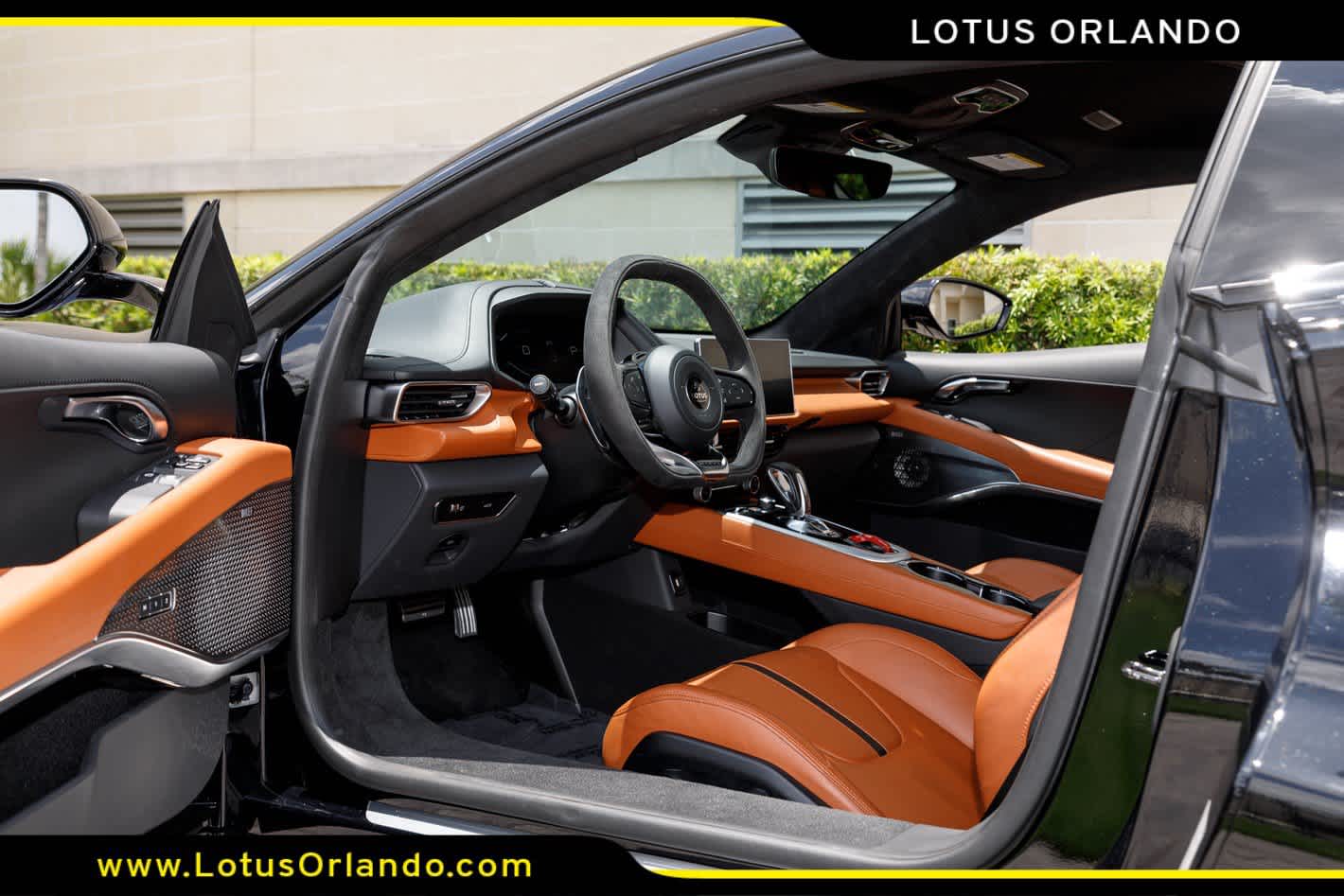 2024 Lotus Emira — rear three-quarter view