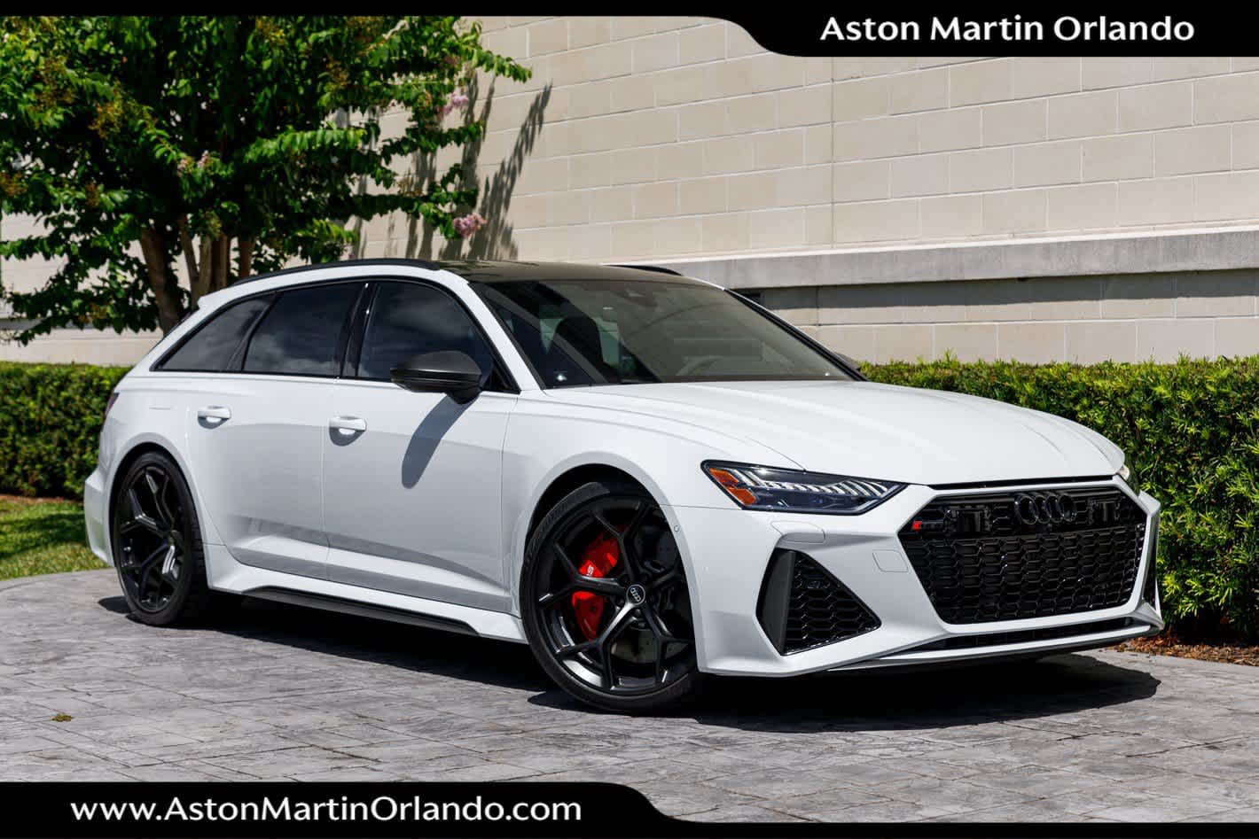2025 Audi RS 6 Avant performance in Glacier White Metallic — front three-quarter view